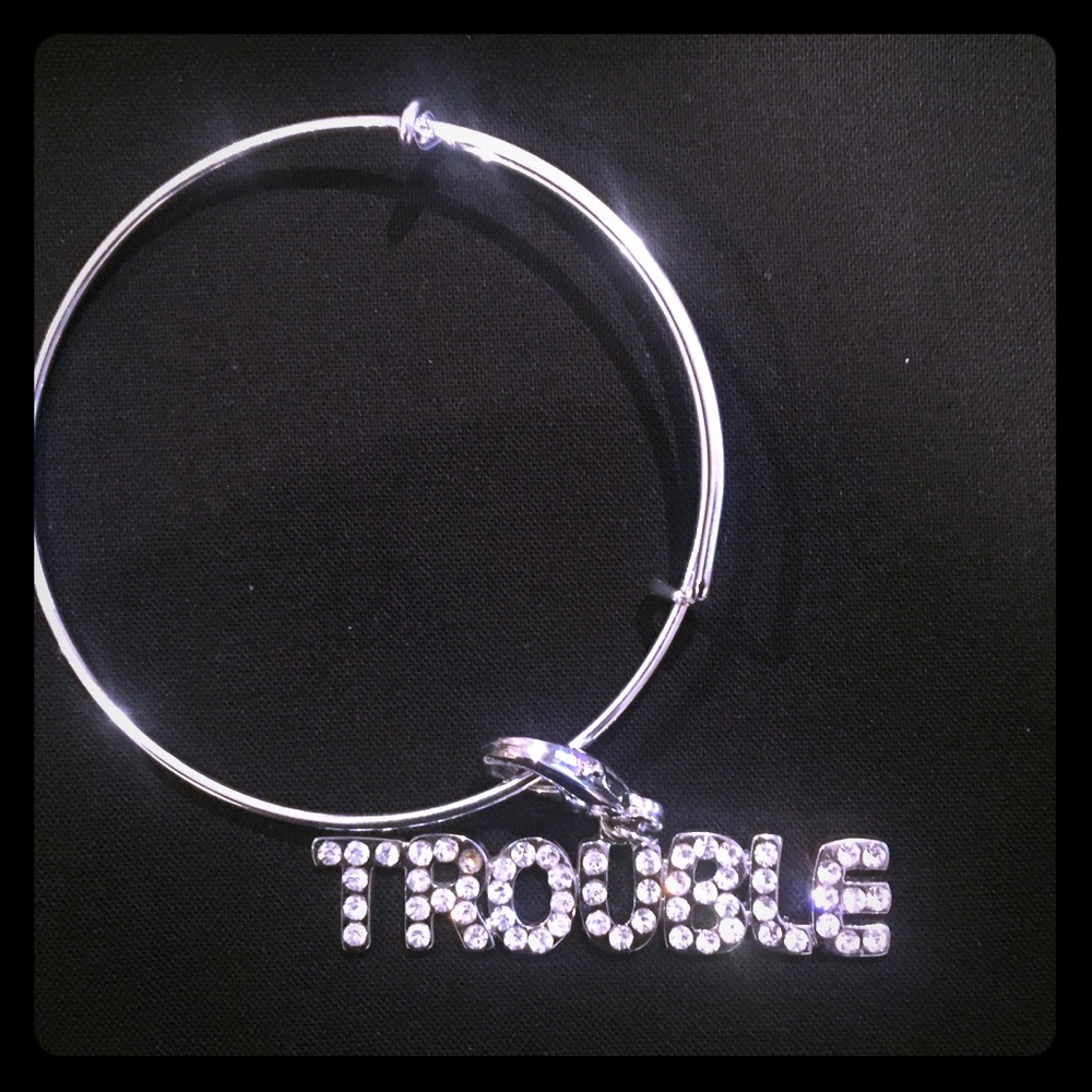 Adjustable trouble charm bracelet